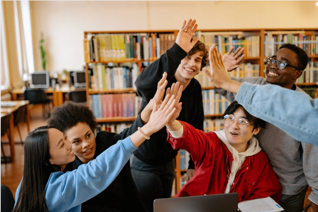 high school students high-fiving