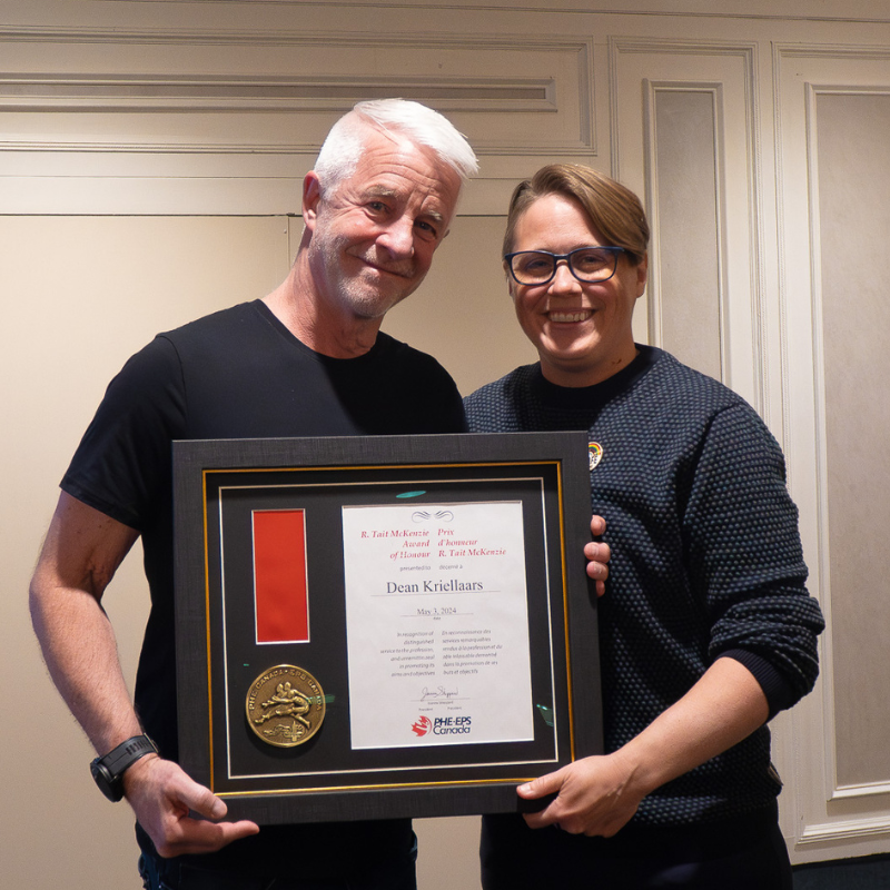 Dean Kriellaars receives the R.Tait award from Jo Sheppard