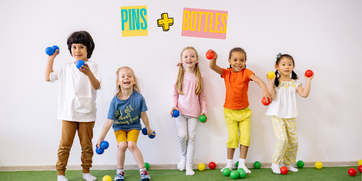 A group of kids are standing against a white wall, smiling and holding colorful balls ready to throw.