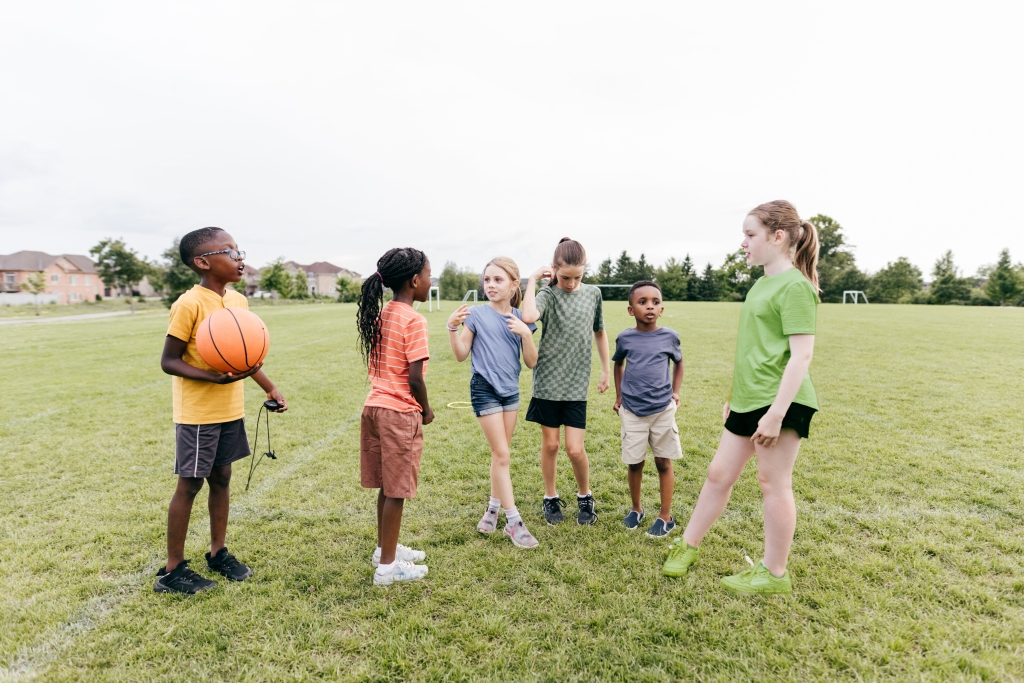 6 students playing outside