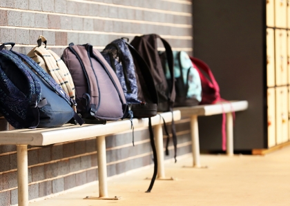 School backpacks on the bench
