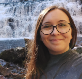 Alyce Casey's profile is showing that Alyce is in front of a waterfall smiling.