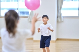 child catching a balloon