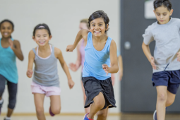 kids running in a gym