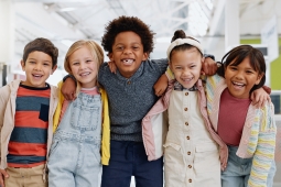 A group of children with happiness shown on their face.