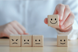 wooden blocks with faces drawn on them