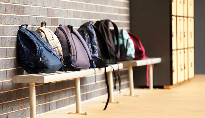 School backpacks on the bench