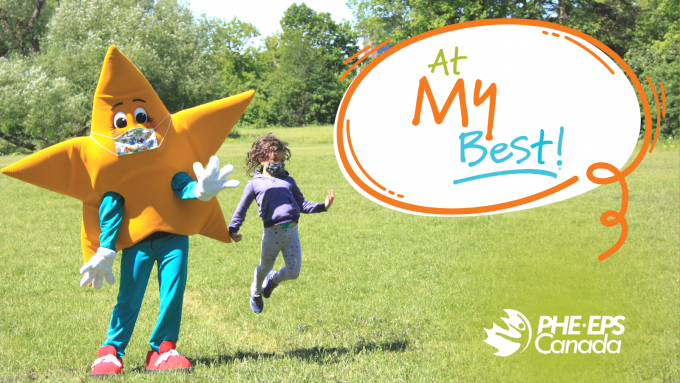 The At My Best program mascot and a young girl jumping and smiling. The At My Best program logo is on the side.