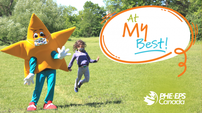 The At My Best program mascot and a young girl jumping and smiling. The At My Best program logo is on the side. 