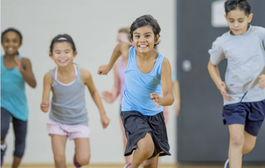 kids running in a gym